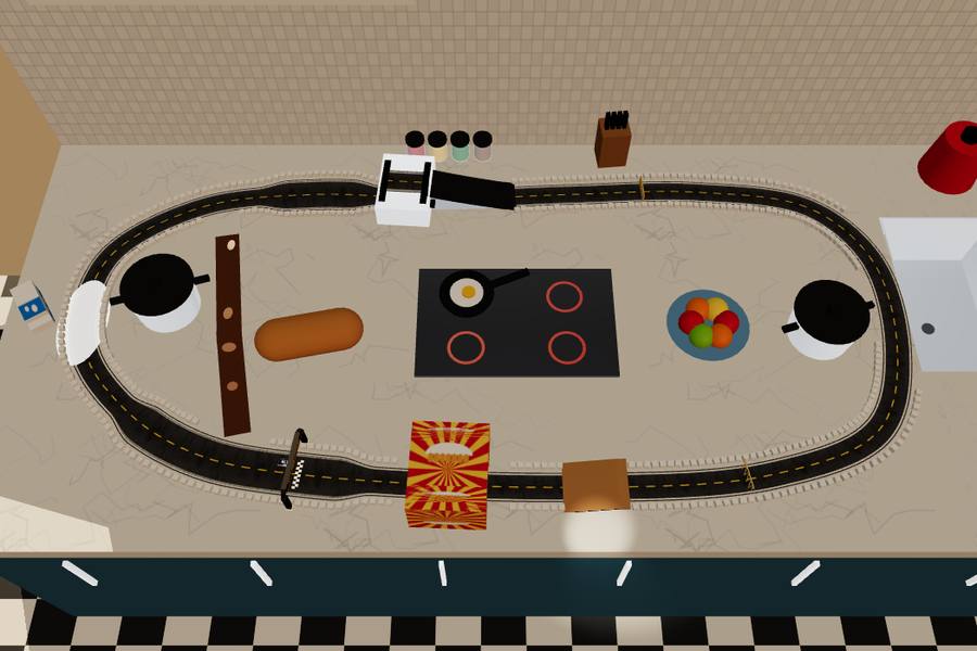 A race track running round a kitchen counter, past the hob and a loaf of bread